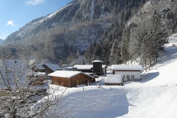 Verschneites Alpendorf in den Hohen Tauern im Sonnenschein | © Ferienregion Nationalpark Hohe Tauern